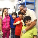 “It’s important to help others in the community,” said Site Manager Emilio Good, with his children.